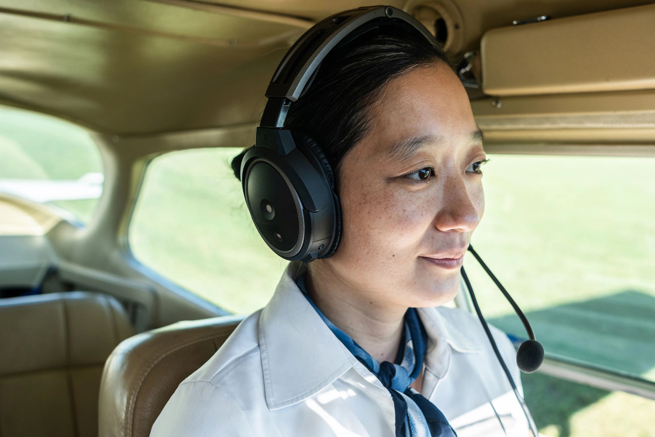 Pilot flying an airplane from the cockpit